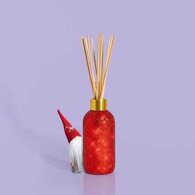Volcano Glam Reed Diffuser product with peek a boo gnome
